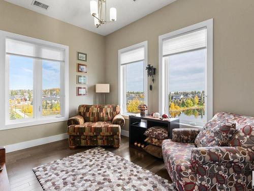 458 6079 Maynard Way, Edmonton, AB - Indoor Photo Showing Living Room