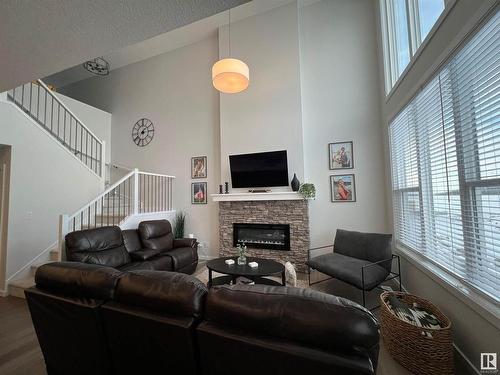 147 Stiles Bend, Leduc, AB - Indoor Photo Showing Living Room With Fireplace