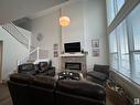 147 Stiles Bend, Leduc, AB  - Indoor Photo Showing Living Room With Fireplace 