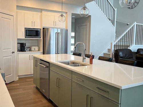 147 Stiles Bend, Leduc, AB - Indoor Photo Showing Kitchen With Double Sink