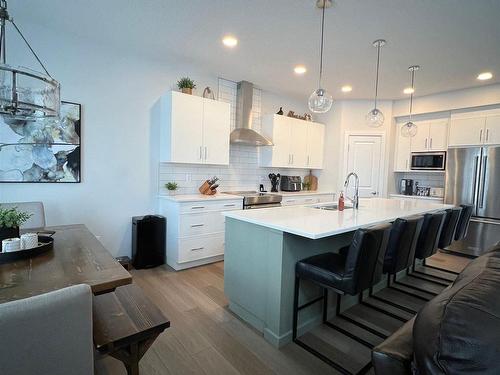 147 Stiles Bend, Leduc, AB - Indoor Photo Showing Kitchen With Stainless Steel Kitchen With Upgraded Kitchen