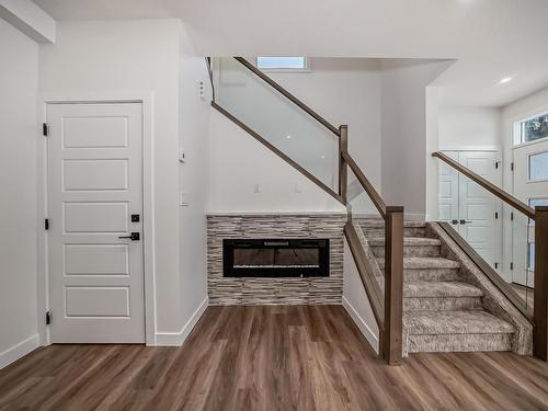 2-12122 43 Street, Edmonton, AB - Indoor Photo Showing Other Room With Fireplace