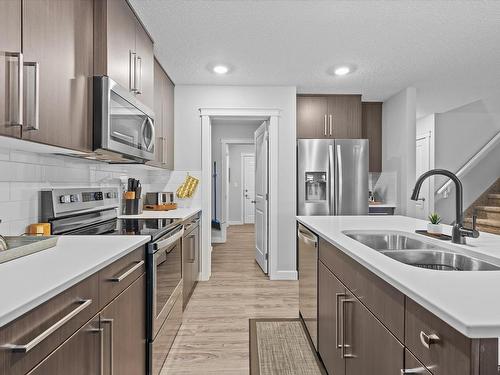 142 Radcliffe Wynd, Fort Saskatchewan, AB - Indoor Photo Showing Kitchen With Double Sink With Upgraded Kitchen