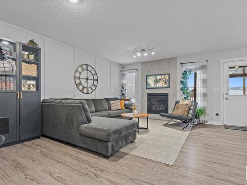 142 Radcliffe Wynd, Fort Saskatchewan, AB - Indoor Photo Showing Living Room With Fireplace