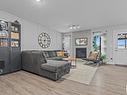 142 Radcliffe Wynd, Fort Saskatchewan, AB  - Indoor Photo Showing Living Room With Fireplace 