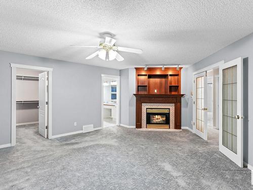 145 Dechene Road, Edmonton, AB - Indoor Photo Showing Living Room With Fireplace