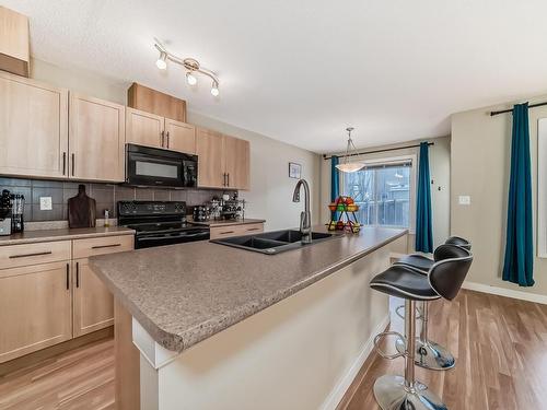 17333 8A Avenue Sw, Edmonton, AB - Indoor Photo Showing Kitchen With Double Sink