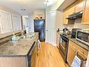 104 Hartwick Loop, Spruce Grove, AB  - Indoor Photo Showing Kitchen With Double Sink 