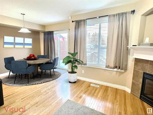 104 Hartwick Loop, Spruce Grove, AB - Indoor Photo Showing Dining Room With Fireplace