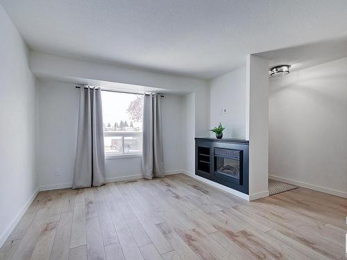 106 Dickinsfield Court, Edmonton, AB - Indoor Photo Showing Living Room With Fireplace