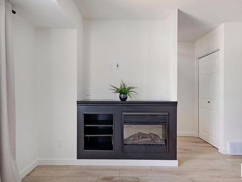 106 Dickinsfield Court, Edmonton, AB - Indoor Photo Showing Living Room With Fireplace