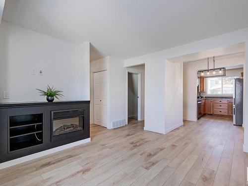 106 Dickinsfield Court, Edmonton, AB - Indoor Photo Showing Living Room With Fireplace