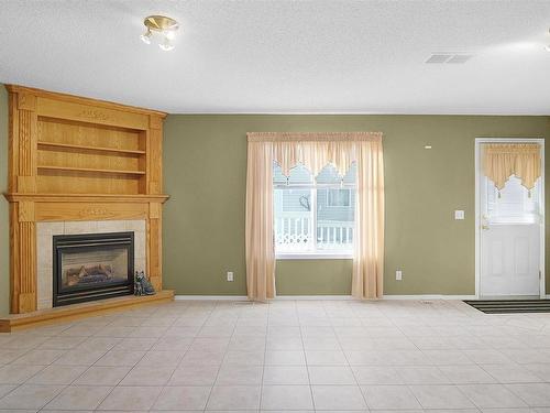 15004 131 Street, Edmonton, AB - Indoor Photo Showing Living Room With Fireplace