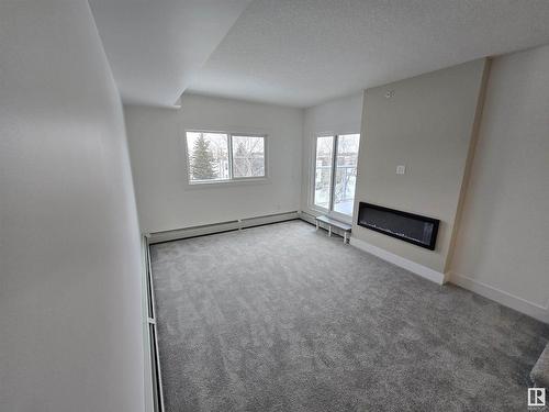 414 9504 182 Street, Edmonton, AB - Indoor With Fireplace