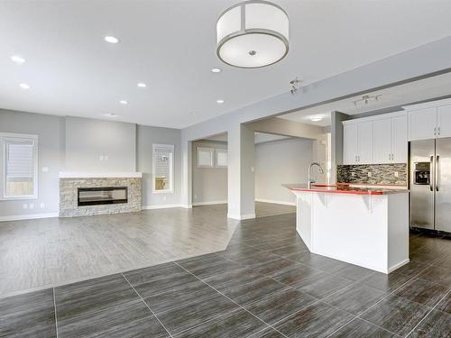 615 176 Street Sw, Edmonton, AB - Indoor Photo Showing Kitchen With Fireplace With Upgraded Kitchen