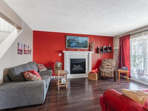 3819 23 Street, Edmonton, AB - Indoor Photo Showing Living Room With Fireplace