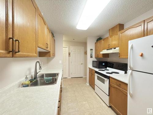 103 17511 98A Avenue, Edmonton, AB - Indoor Photo Showing Kitchen With Double Sink