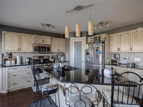 76 Dalquist Bay, Leduc, AB - Indoor Photo Showing Kitchen With Double Sink