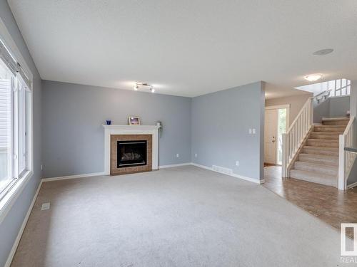 1050 Mckinney Green, Edmonton, AB - Indoor Photo Showing Living Room With Fireplace