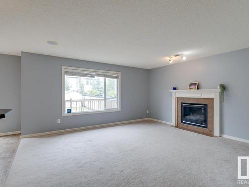 1050 Mckinney Green, Edmonton, AB - Indoor Photo Showing Living Room With Fireplace