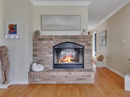 245008 Twp Rd 474, Rural Wetaskiwin County, AB - Indoor Photo Showing Living Room With Fireplace