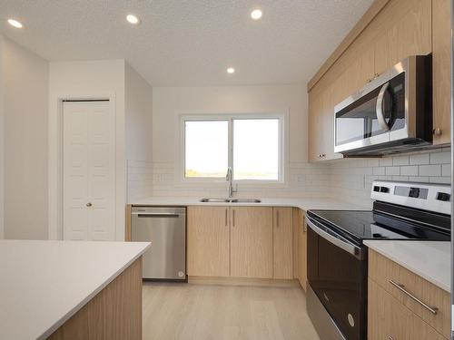 2448 Trumpeter Way, Edmonton, AB - Indoor Photo Showing Kitchen With Stainless Steel Kitchen With Double Sink