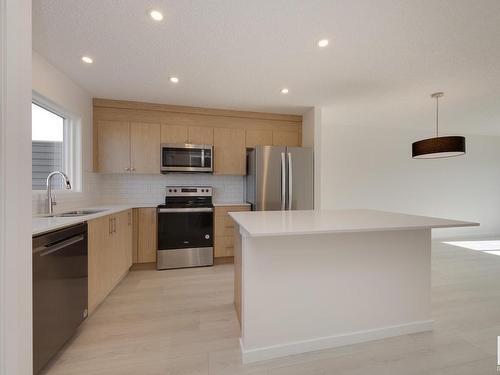 2448 Trumpeter Way, Edmonton, AB - Indoor Photo Showing Kitchen With Stainless Steel Kitchen