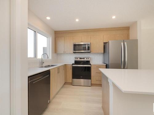 2454 Trumpeter Way, Edmonton, AB - Indoor Photo Showing Kitchen With Stainless Steel Kitchen With Double Sink