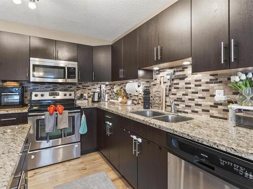 6914 19A Avenue, Edmonton, AB - Indoor Photo Showing Kitchen With Stainless Steel Kitchen With Double Sink With Upgraded Kitchen