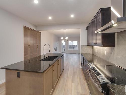 175 Stonehouse Way, Leduc, AB - Indoor Photo Showing Kitchen With Upgraded Kitchen