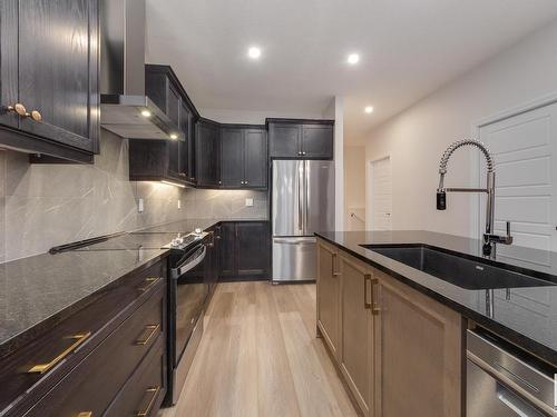 175 Stonehouse Way, Leduc, AB - Indoor Photo Showing Kitchen With Stainless Steel Kitchen With Upgraded Kitchen