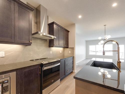 177 Stonehouse Way, Leduc, AB - Indoor Photo Showing Kitchen With Upgraded Kitchen