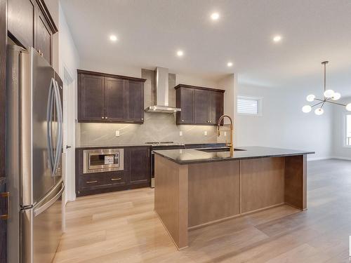 177 Stonehouse Way, Leduc, AB - Indoor Photo Showing Kitchen With Stainless Steel Kitchen With Upgraded Kitchen