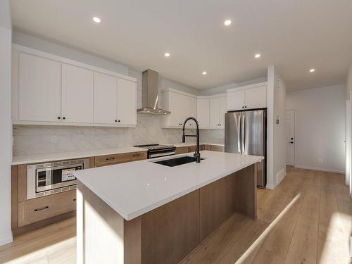 179 Stonehouse Way, Leduc, AB - Indoor Photo Showing Kitchen With Stainless Steel Kitchen With Upgraded Kitchen