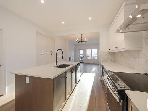 179 Stonehouse Way, Leduc, AB - Indoor Photo Showing Kitchen With Upgraded Kitchen