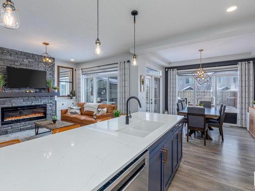 4658 Alwood Way, Edmonton, AB - Indoor Photo Showing Kitchen With Fireplace With Double Sink