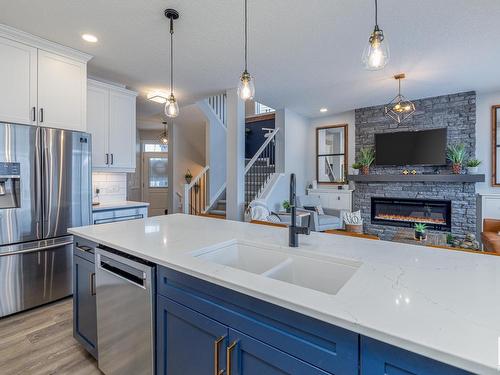 4658 Alwood Way, Edmonton, AB - Indoor Photo Showing Kitchen With Fireplace With Stainless Steel Kitchen With Double Sink With Upgraded Kitchen