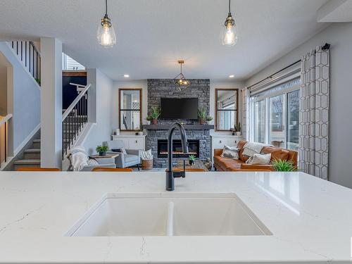 4658 Alwood Way, Edmonton, AB - Indoor Photo Showing Kitchen With Fireplace