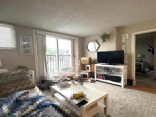 202 9730 106 Street, Edmonton, AB - Indoor Photo Showing Living Room