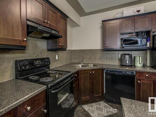 109 4415 48 Street, Leduc, AB - Indoor Photo Showing Kitchen With Double Sink