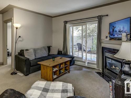 109 4415 48 Street, Leduc, AB - Indoor Photo Showing Living Room With Fireplace