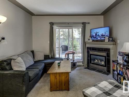 109 4415 48 Street, Leduc, AB - Indoor Photo Showing Living Room With Fireplace