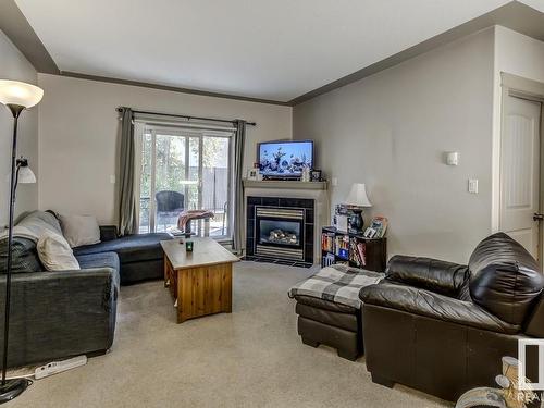 109 4415 48 Street, Leduc, AB - Indoor Photo Showing Living Room With Fireplace