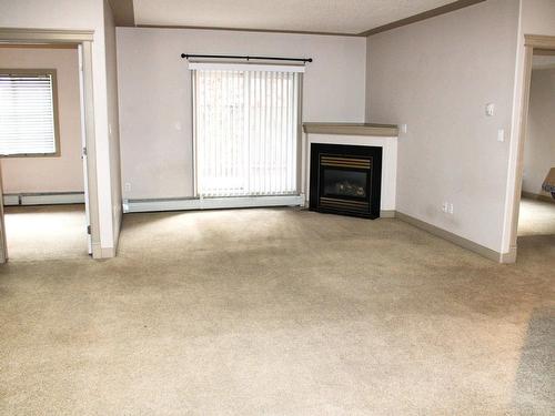 109 4415 48 Street, Leduc, AB - Indoor Photo Showing Living Room With Fireplace