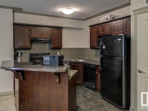 109 4415 48 Street, Leduc, AB - Indoor Photo Showing Kitchen With Double Sink