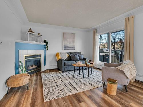 36 9914 80 Avenue, Edmonton, AB - Indoor Photo Showing Living Room With Fireplace