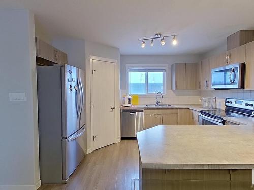 2205 16 Ave, Edmonton, AB - Indoor Photo Showing Kitchen With Stainless Steel Kitchen With Double Sink