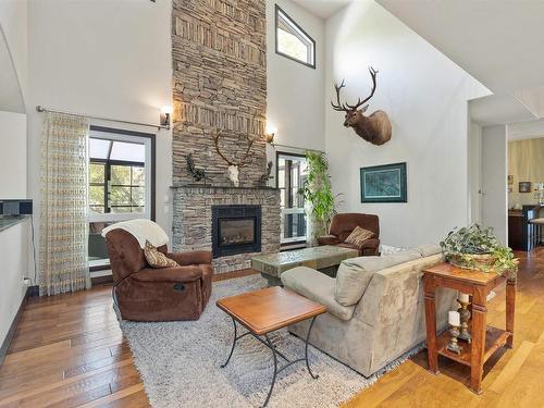 57 54315 Rge Rd 251, Rural Sturgeon County, AB - Indoor Photo Showing Living Room With Fireplace