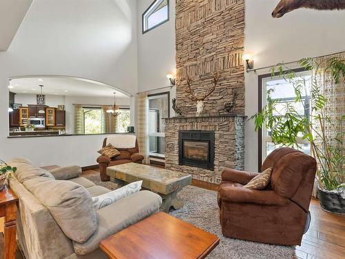 57 54315 Rge Rd 251, Rural Sturgeon County, AB - Indoor Photo Showing Living Room With Fireplace