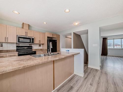 12 Fairfax Lane, Devon, AB - Indoor Photo Showing Kitchen With Double Sink